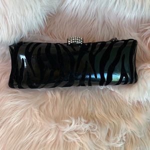 Ladies white/black zebra print small shoulder bag.